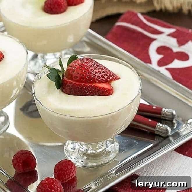 White Chocolate Mousse with Frangelico, garnished with berries and mint