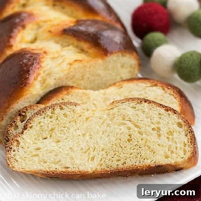 Freshly Baked Swiss Butter Braid Slices - A Delightful Treat Tender slices of Swiss Butter Braid (Butterzopf) arranged elegantly on a white platter, revealing its soft, airy crumb.