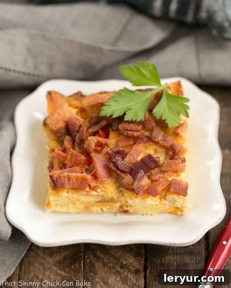 Bacon and Egg Strata | A delightful breakfast casserole featuring savory croutons, sharp cheddar cheese, crispy bacon, and fluffy eggs, perfect for any occasion.