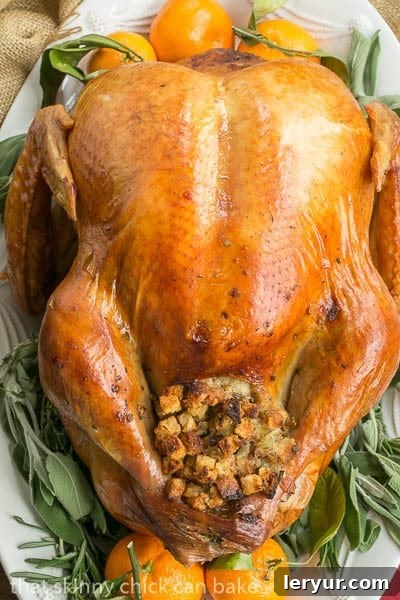 Overhead view of Dry Brined Turkey with sage, rosemary and oranges.