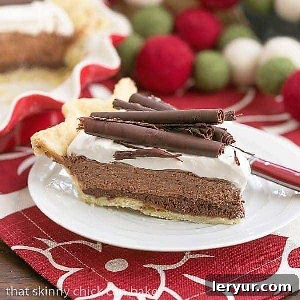 Decadent Black Bottom Chocolate Mousse Pie Recipe - A Sweet Sensation! A perfectly sliced Black Bottom Chocolate Mousse Pie with delicate chocolate curls as garnish, ready to be served.