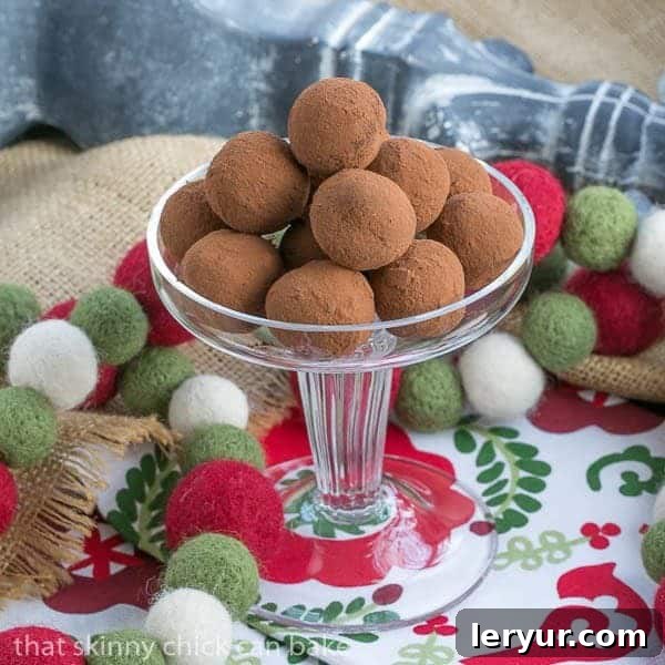 Caramel Filled Chocolate Truffles piled on a glass pedestal.