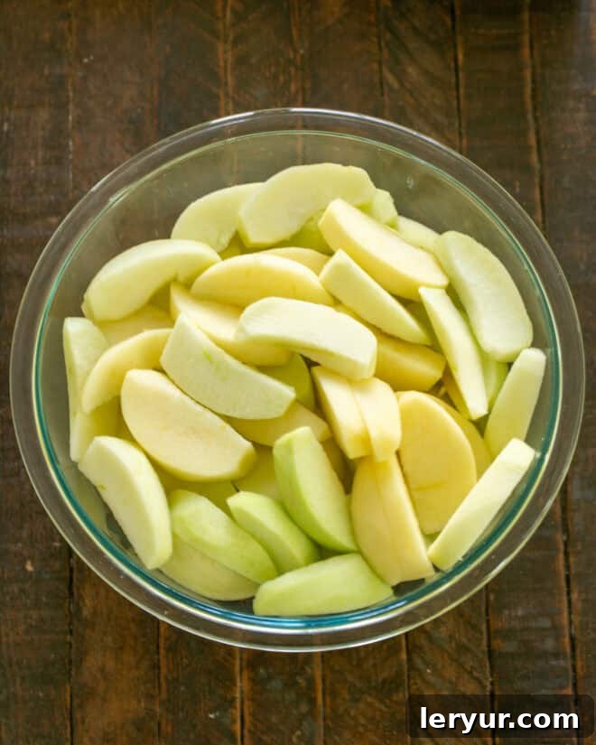 Apples sliced for apple crisp.