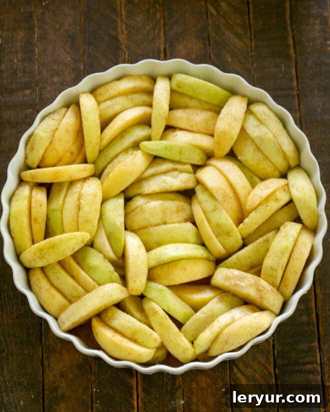 Apples added to baking dish.
