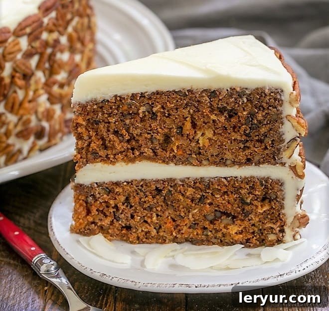 Scrumptious Carrot Cake with Coconut, Crushed Pineapple, and Pecans, iced with Cream Cheese Frosting.