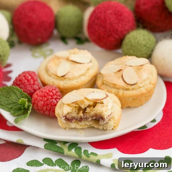 Almond Raspberry Tartlets | Raspberry jam and almond paste fill cream cheese pastry tartlets