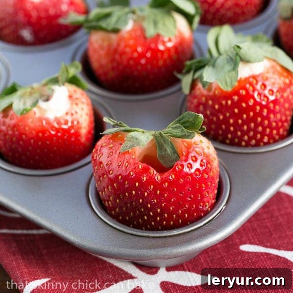Mascarpone Filled Chocolate Covered Strawberries - a dreamy combination of berries, cream and chocolate! Mascarpone Filled Chocolate Covered Strawberries in a mini muffin tin ready to be filled