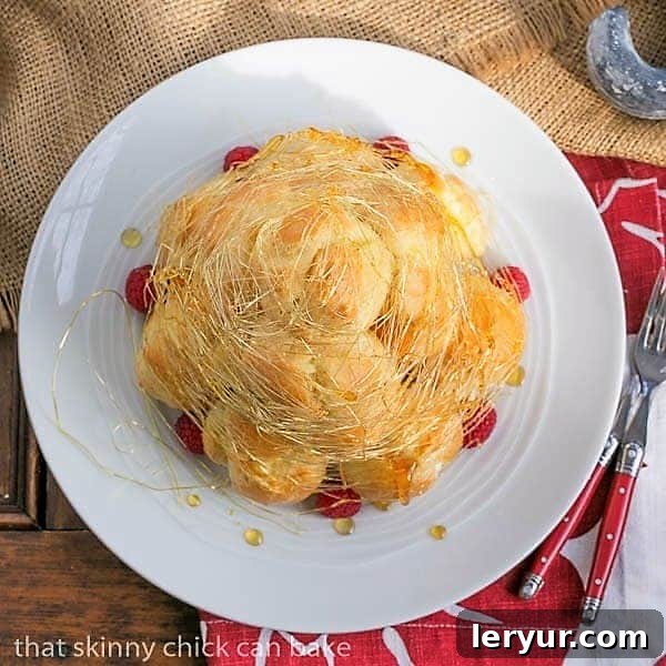 An overhead shot showcasing the elegant Lemon Cream Croquembouche, highlighting its intricate structure and delicate spun sugar. It's a true masterpiece from above.