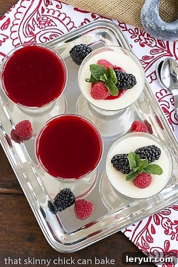 White Chocolate Panna Cotta - topped with a raspberry sauce or berries for an elegant Italian dessert An inviting overhead view of multiple servings of Vanilla Bean Panna Cotta beautifully arranged on a gleaming silver tray, showcasing its smooth texture and elegant simplicity.