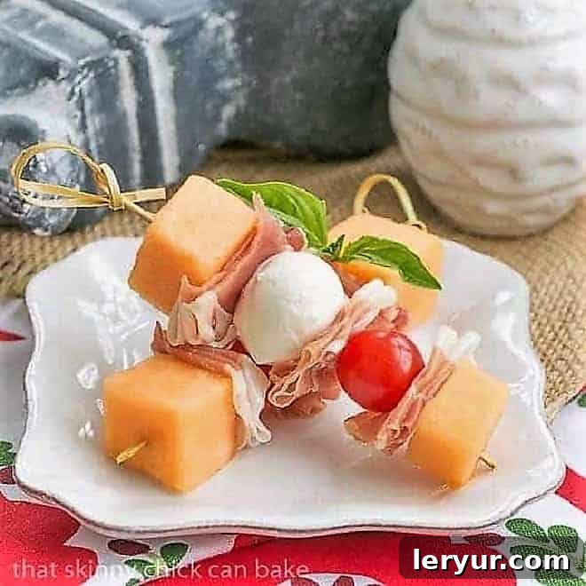 Melon and Prosciutto Skewers - The Quintessential Easy Italian Appetizer Exquisite Melon and Prosciutto Skewers arranged on a small white appetizer plate, ready to be served.