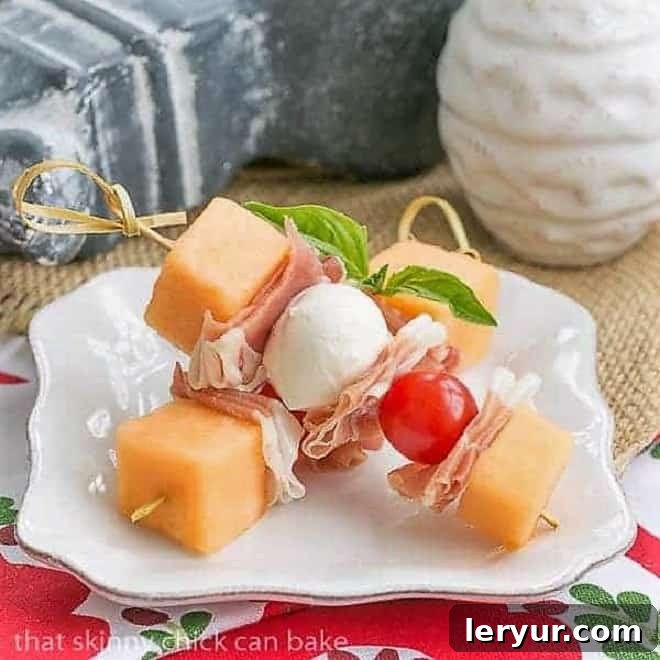Melon and Prosciutto Skewers on a small white appetizer plate