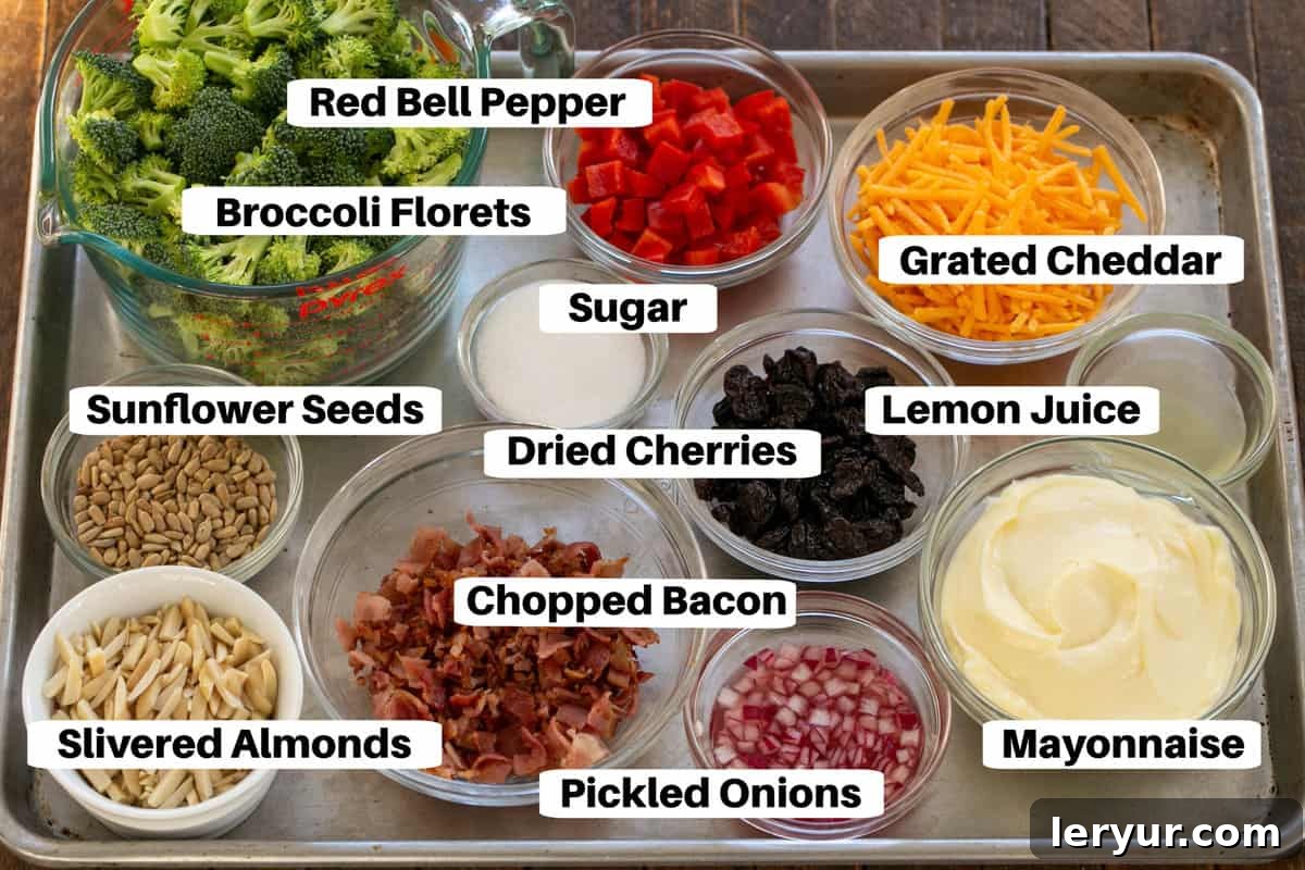 Sweet and Savory Broccoli Crunch Salad 2 Broccoli Salad Ingredients laid out on a metal sheet pan with labels.