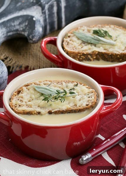 Hangover Soup - The perfect way to nurse a hangover or a wicked cold Hangover Soup generously topped with golden cheesy toasts and fresh herbs, a truly comforting sight.