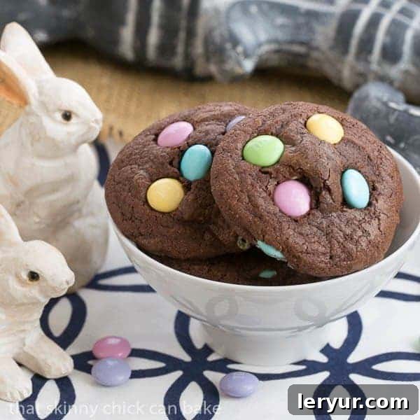 Two Easter brownie cookies with colorful pastel M&Ms, presented in an overhead view, highlighting their inviting texture and festive appearance.