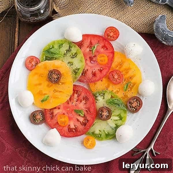 Salade de Tomates et Fromage - A quintessential French salad featuring ripe tomatoes, fresh mozzarella, and aromatic basil. Vibrant Salade de Tomates et Fromage on a pristine white ceramic plate, showcasing juicy red tomatoes and creamy white mozzarella.