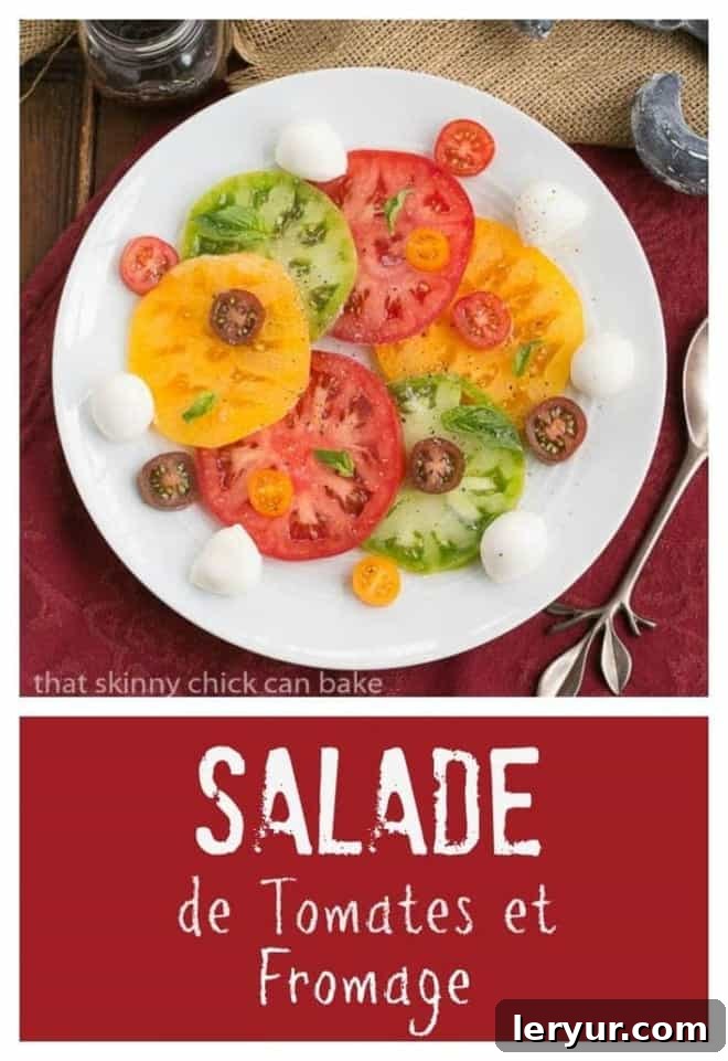 Salade de Tomates et Fromage - A simple and refreshing French salad for any occasion. Salade de Tomates et Fromage elegantly presented on a large white plate, capturing the freshness of the ingredients.