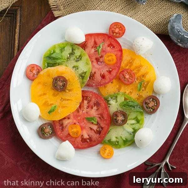 Salade de Tomates et Fromage | A simple French salad of juicy ripe tomatoes, fresh mozzarella, and aromatic basil.