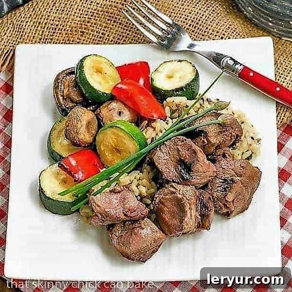 Grilled Teriyaki Beef - Tender grilled beef and veggies flavored with an Asian marinade Beef Teriyaki Kabobs on a square white plate, ready to be enjoyed.