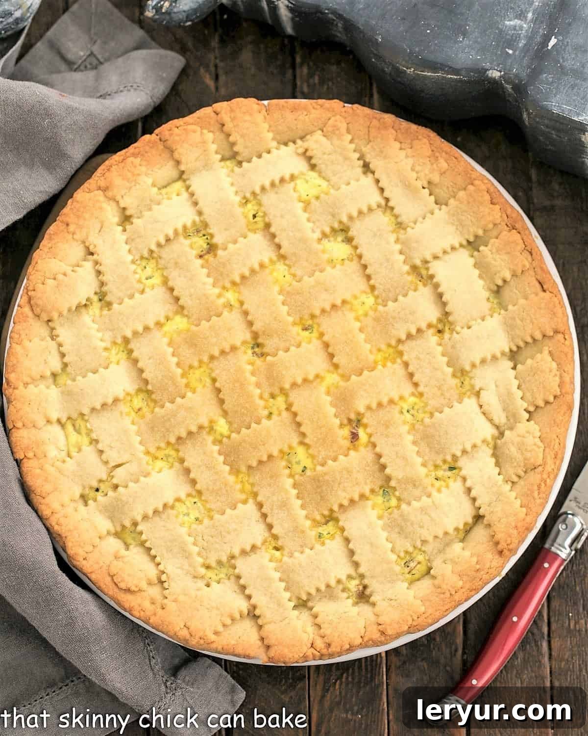 Overhead view of Pizza Rustica next to a red handled knife.