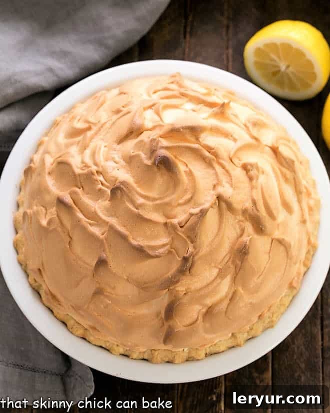 Mile High Lemon Meringue Perfection 3 Overhead view of lemon meringue pie in a white ceramic pie plate