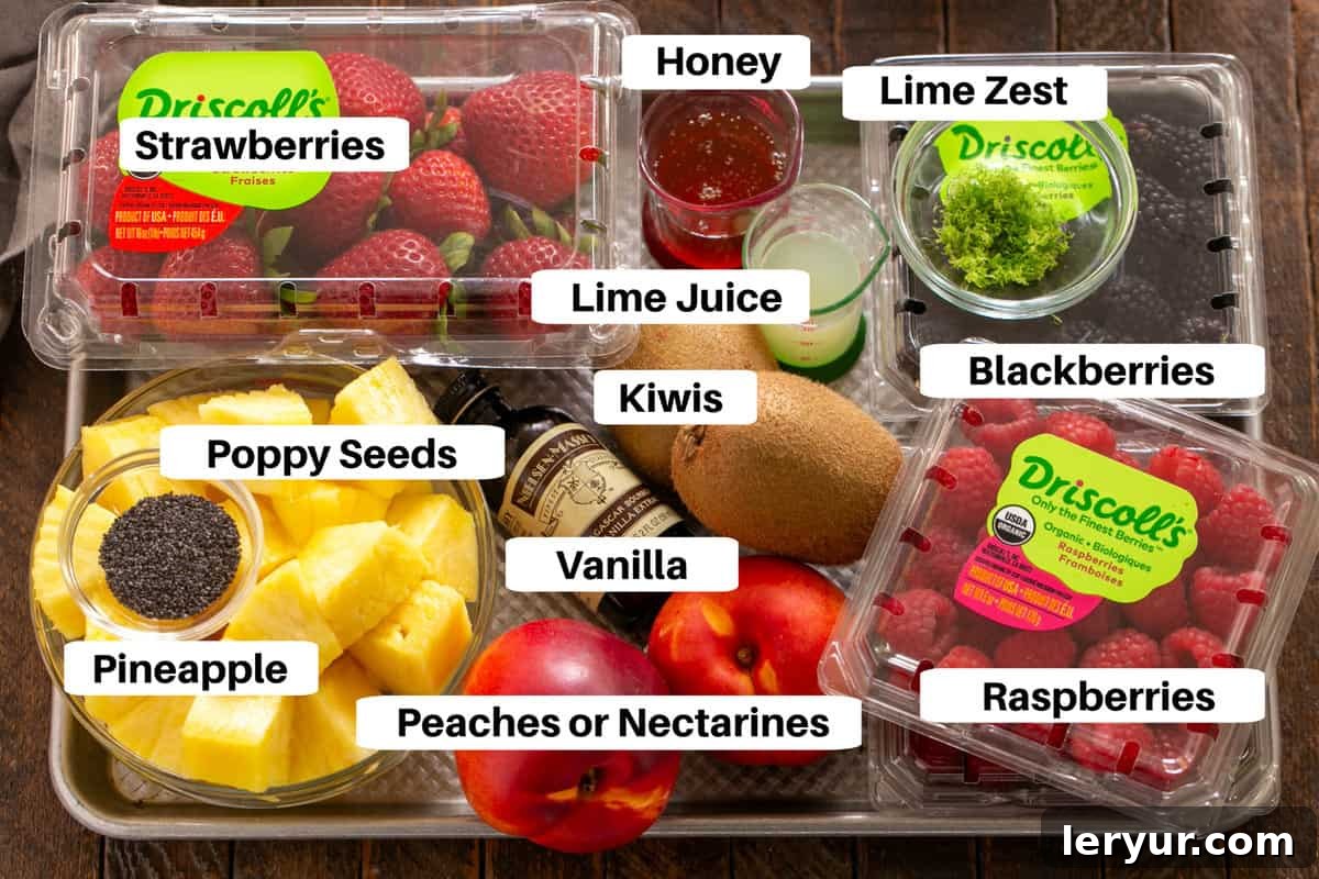 Zesty Honey-Lime Fruit Medley 2 Honey Lime Fruit Salad ingredients laid out on a sheet pan, clearly labeled for easy understanding.