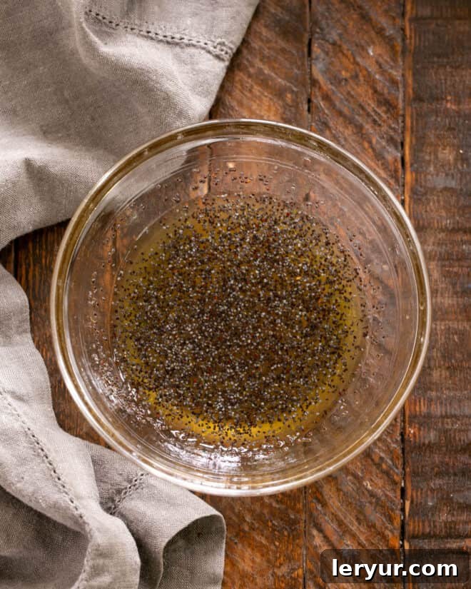 Zesty Honey-Lime Fruit Medley 3 Whisking together the honey lime dressing ingredients in a small bowl.
