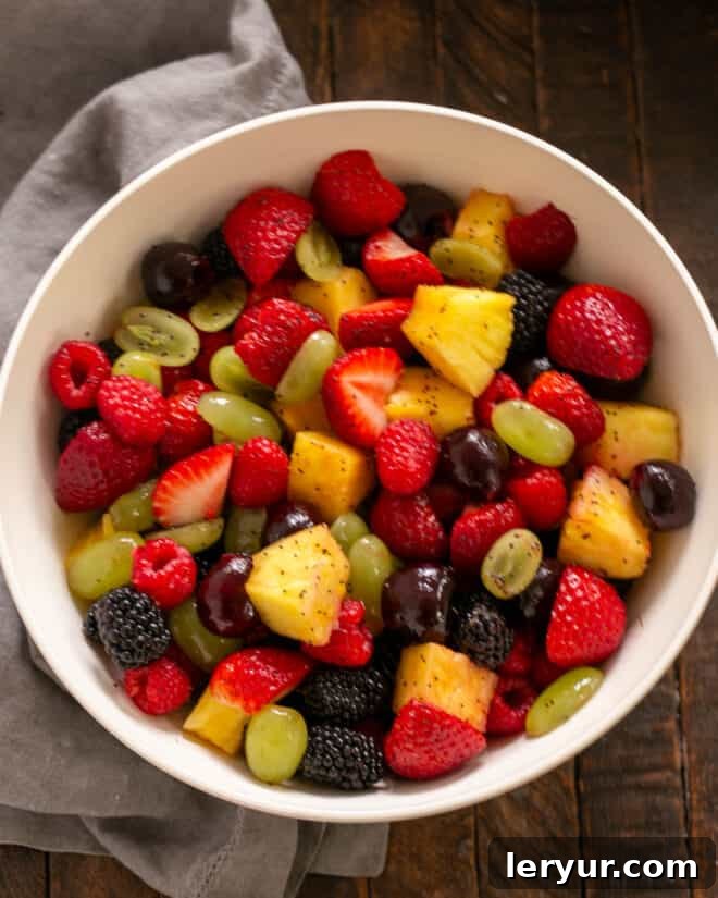 Zesty Honey-Lime Fruit Medley 5 Gently tossing the fresh fruit with the honey lime dressing in a mixing bowl.