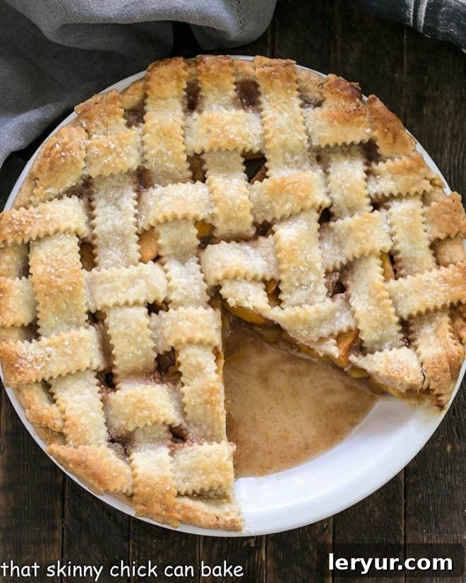 Sweet Summer Peach Lattice Pie 7 Peach Pie with a lattice crust with a slice removed