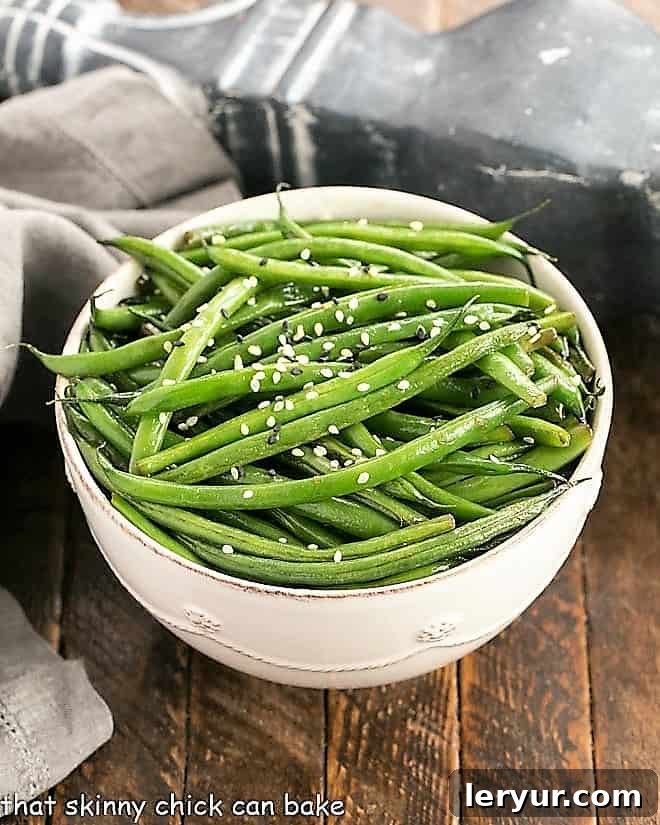 Overhead view of Asian Green Beans served in a white ceramic bowl, ready to be enjoyed.