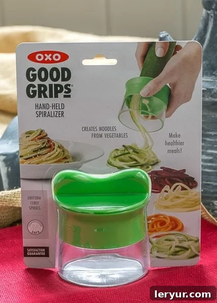 Zucchini Noodles with Parmesan - Make with a hand held spiralizer OXO hand-held spiralizer in action, creating perfect zucchini noodles.