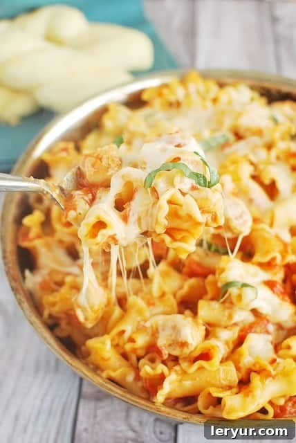 Chicken Parmesan Baked Pasta, a simple baked pasta with chicken, tomato sauce, mozzarella, and Parmesan.