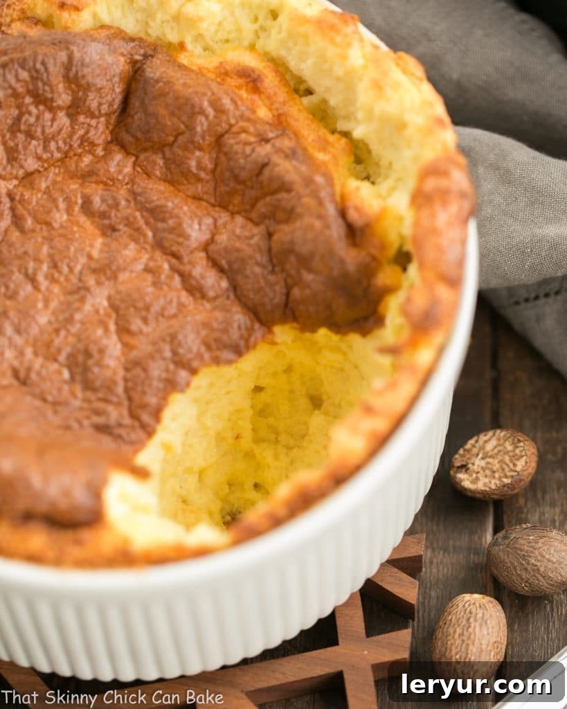 French Souffle Recipe - a dreamy cheese souffle flavored with Swiss cheese, nutmeg and a pinch of cayenne Close-up internal view of a French Gruyere Souffle, revealing its airy, tender texture and rich cheesy interior.