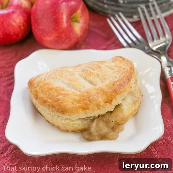 Chaussons aux Pommes - Easy delicious apple turnovers! Chaussons aux Pommes with filling seeping out.