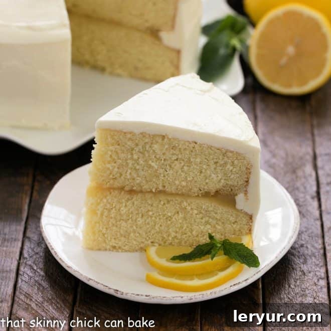 Lemon Layer Cake slice on a white dessert plate