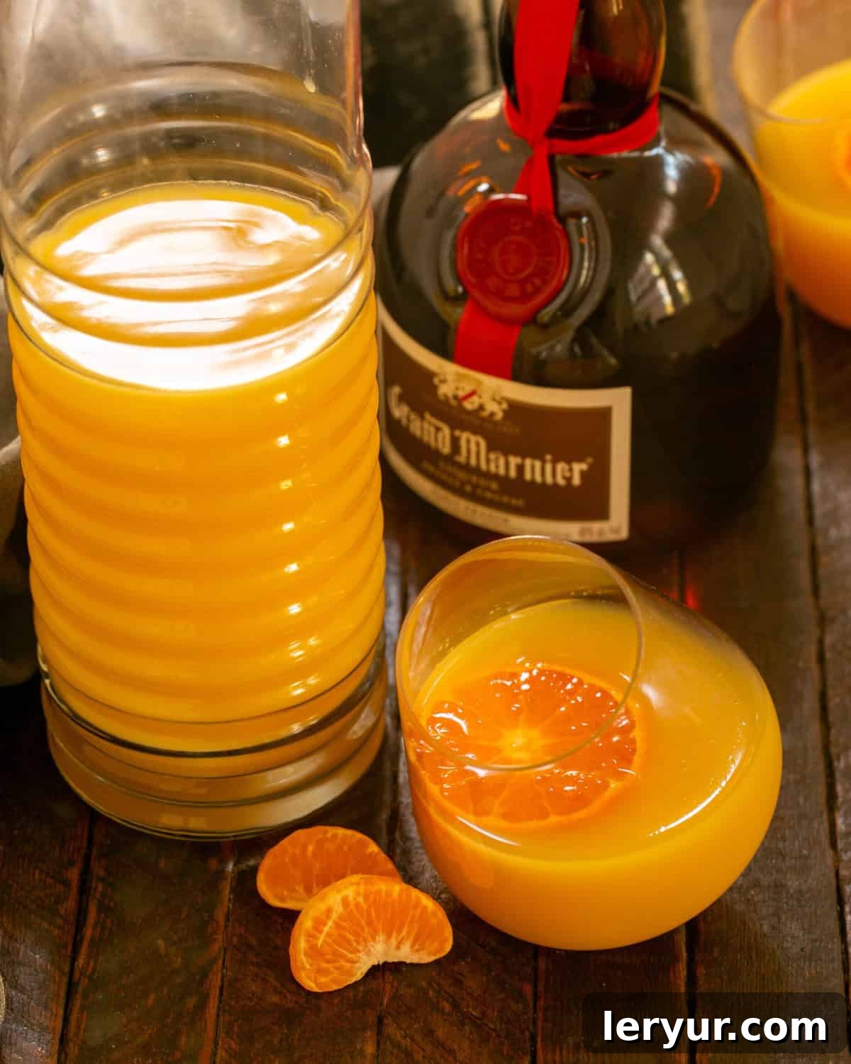 Elevated Grand Marnier Mimosas 4 A perfectly poured Grand Mimosa in a Viski glass next to a bottle of Grand Marnier, highlighting the elegant presentation.