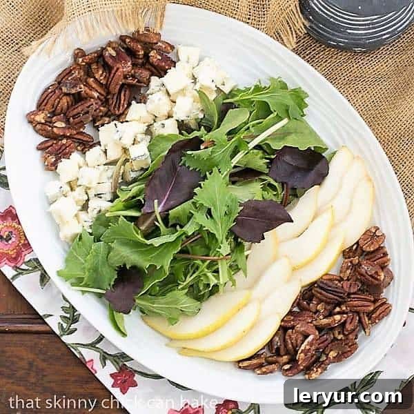 Sweet Pear, Bold Blue Salad 2 Blue Cheese and Pear Salad on a white, oval ceramic plate