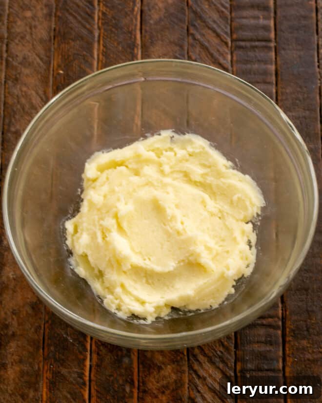 Whimsical Holiday Sugar Cookie Designs 4 Step 1: Combine softened butter, cream cheese, and sugar in a mixing bowl until the mixture is light and fluffy.