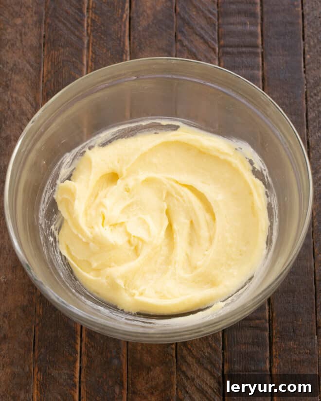 Whimsical Holiday Sugar Cookie Designs 5 Step 2: Incorporate the egg and vanilla extract into the creamed mixture, beating until well combined.
