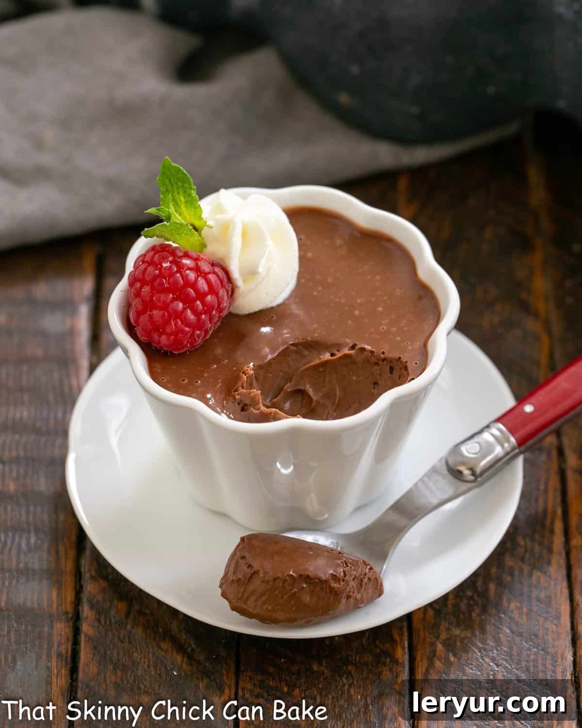 Silky Irish Cream Pots de Creme 2 Irish cream pots de creme in a white ramekin with a spoonful removed.