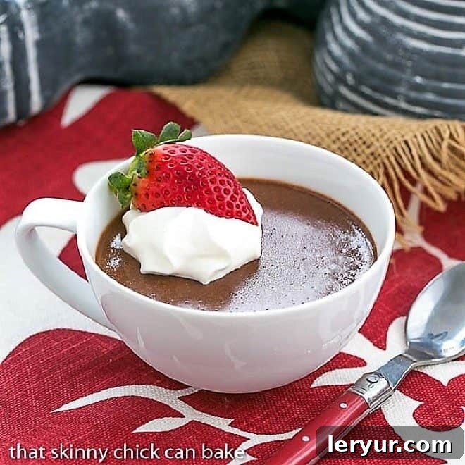 Irish Cream Pots de Creme - Rich and silky pots de creme flavored with Irish cream Chocolate Custard in a white tea cup.