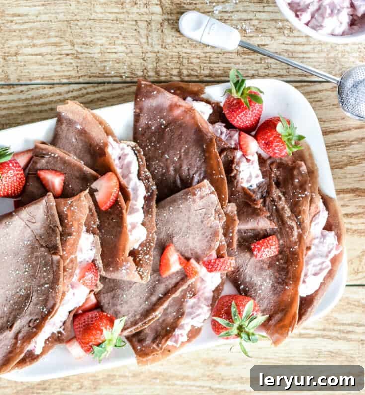 Strawberry Cheesecake Chocolate Crepes, perfect for a special holiday breakfast or brunch.