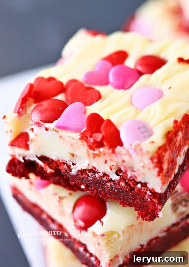 Valentine Red Velvet Brownies with frosting, M&M's, and sprinkles.