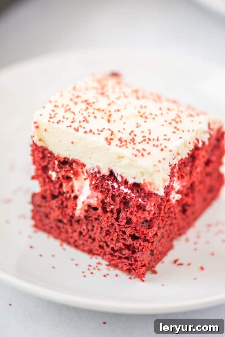 Easy Red Velvet Poke Cake with Best Ever Cream Cheese Buttercream, a festive dessert.