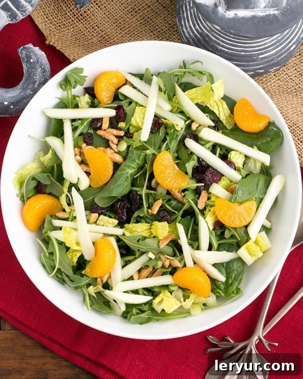Beautifully plated Holiday Lettuce Salad with a red napkin, ready to be served.