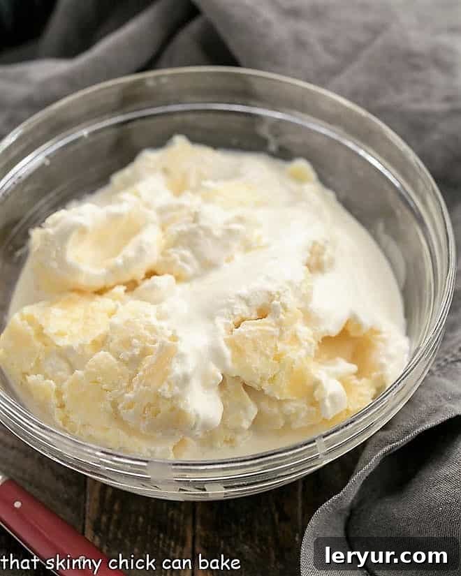 A beautiful bowl of homemade clotted cream, freshly scooped from the Instant Pot, ready to be served.