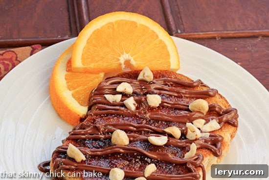 A delectable Nutella Tartine, perfectly toasted and generously spread, showcasing its irresistible appeal as a French-inspired snack.