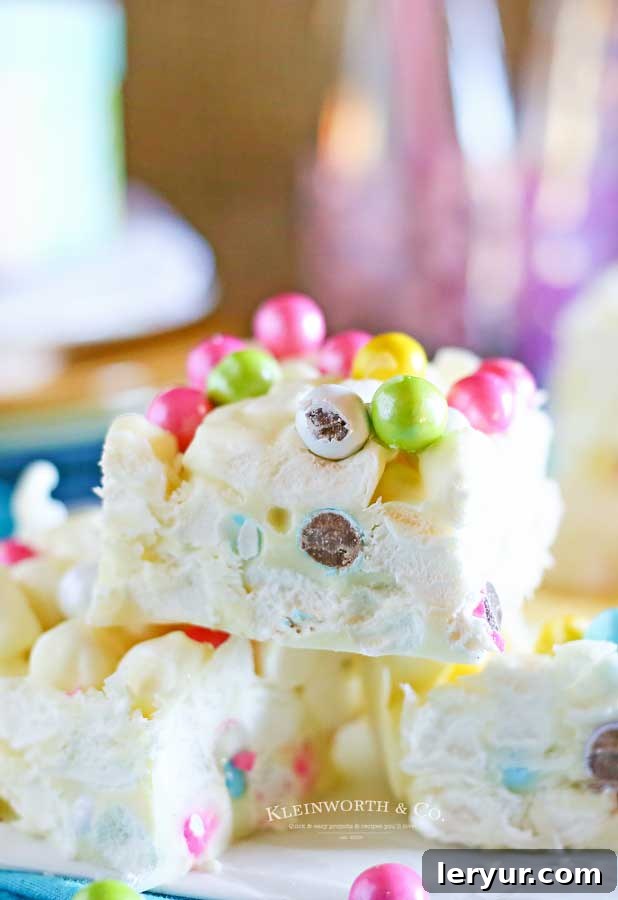 Fun and festive no-bake marshmallow Easter bars, featuring a chewy, sweet, and colorful treat perfect for holiday enjoyment.