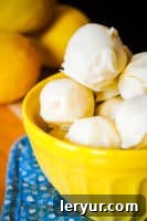 Decadent Lemon Coconut Truffles, offering a delightful and sweet taste of citrus perfectly balanced with tropical coconut for the spring season.