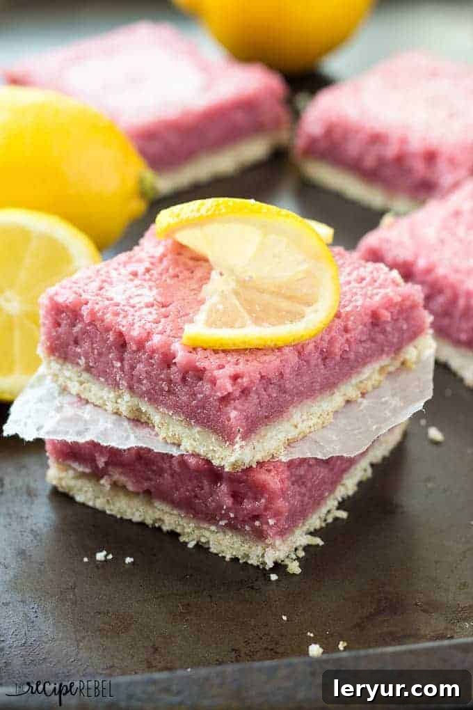 Refreshing Strawberry Pineapple Lemonade Bars, with layers of sweet and tangy fruit flavors, perfect for a spring potluck or warm-weather treat.