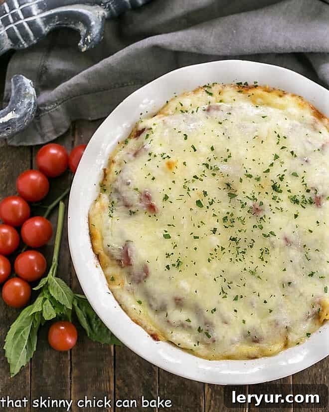 An aerial view of the delicious Spaghetti Casserole, perfectly baked with its golden cheese topping and inviting layers visible from above.